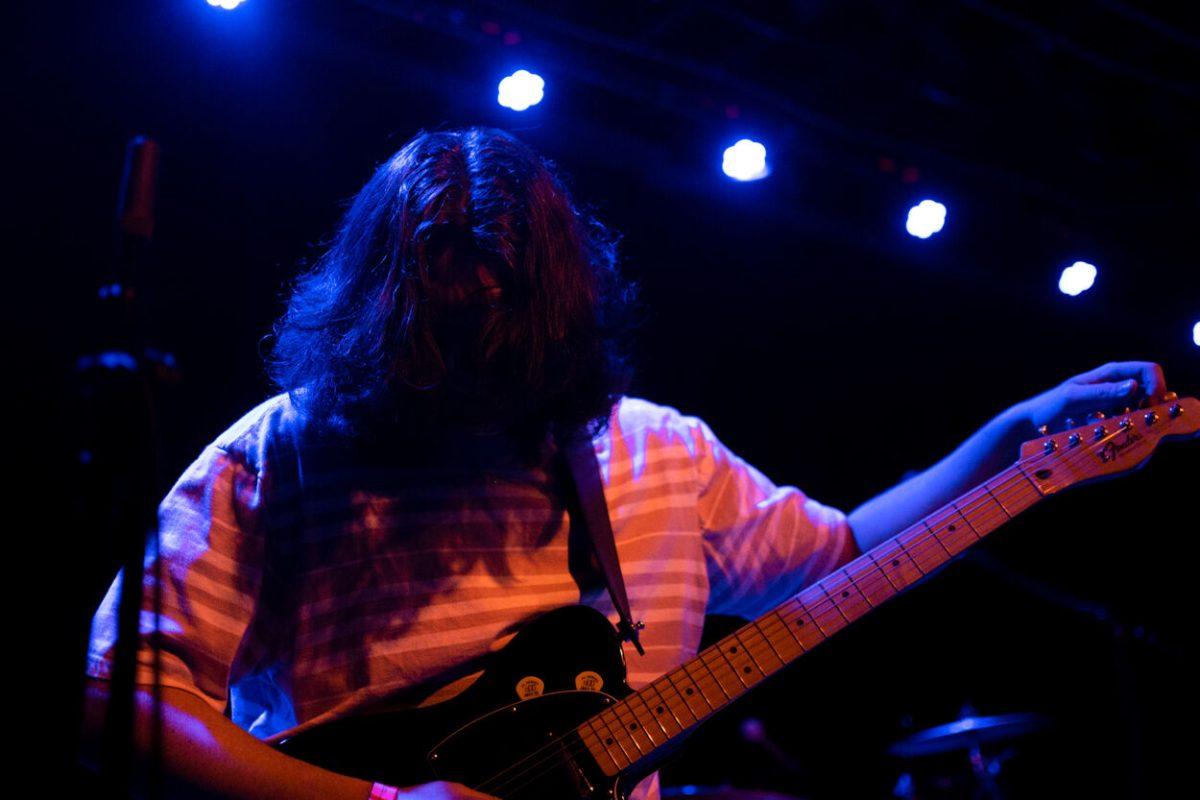 Jack O'Brien tunes his guitar during Raygun Superstar's performance at Motorco Music Hall in Durham, NC, on Friday,&#160;April 29, 2022.