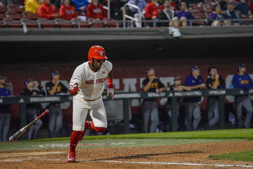 Senior outfielder Devonte Brown runs to first during NC State's home game against East Carolina on Tuesday, April 26, 2022 in Doak Field at Dail Park. Brown hit a leadoff home run during the Wolfpack's 12-3 win over the Pirates.