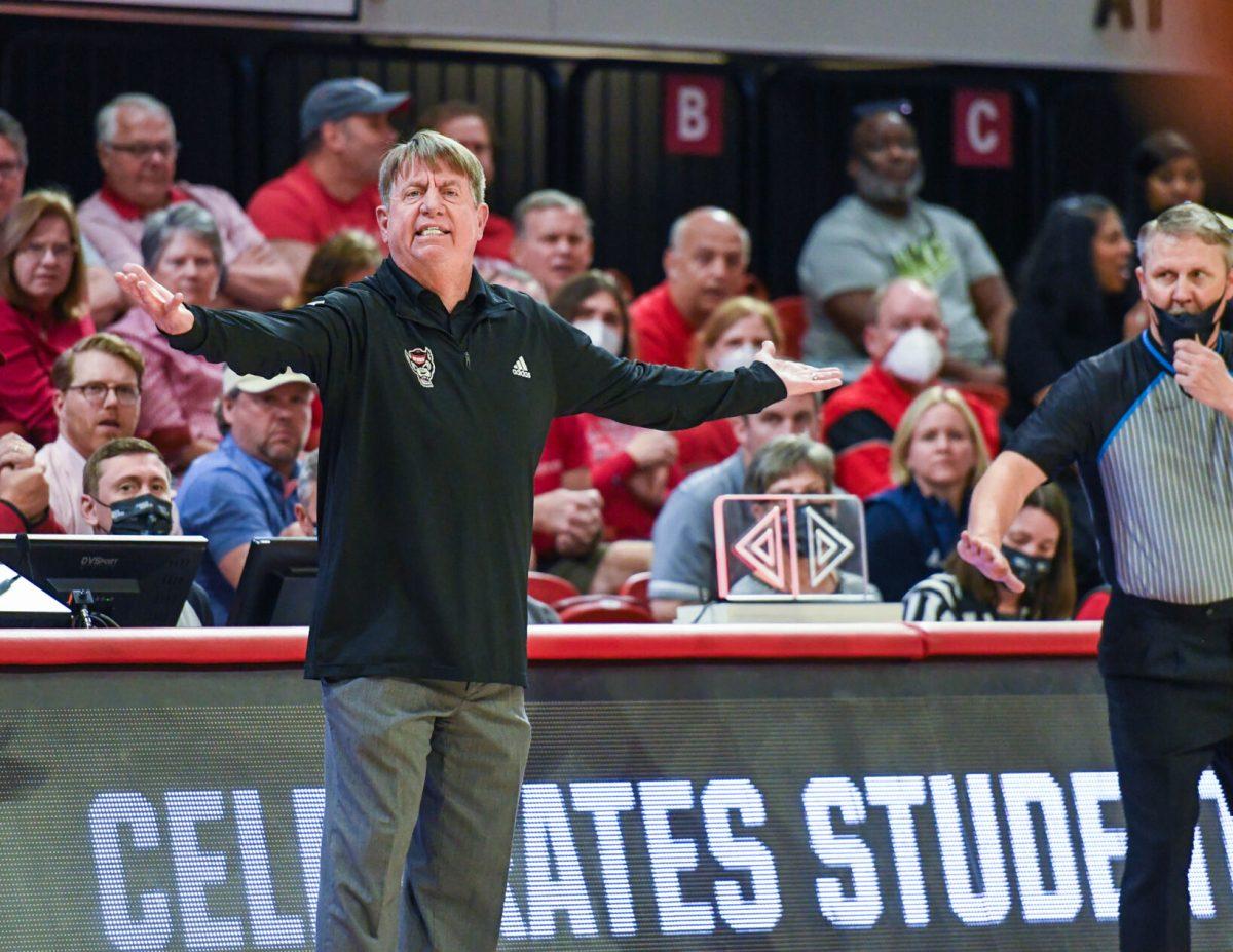 Head coach Wes Moore questions a call from the referee during the first round game of the NCAA Tournament on Saturday, March 19, 2022 in Reynolds Coliseum. The Wolfpack beat the Lancers 96-68.