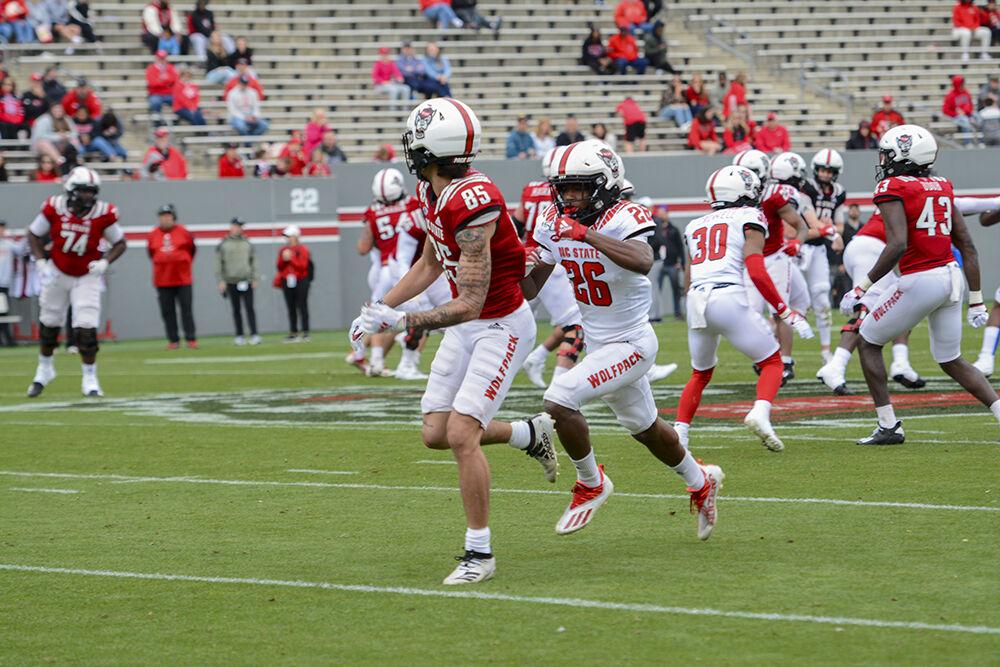Sophomore wide receiver Anthony Smith sprints away from freshman defensive back Jackson Vick during the Spring Game on April 9, 2021 at Carter-Finley Stadium. Smith scored one touchdown with the Red team beating the White team 50-7.