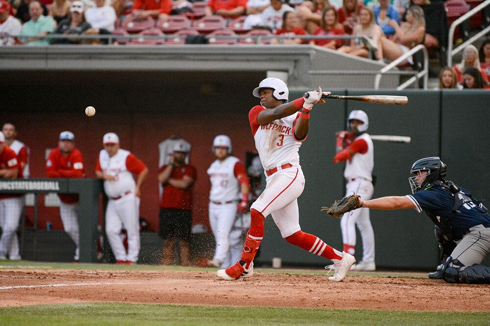 Senior infielder Devonte Brown swings the bat during the baseball game against UNC-Wilmington at Doak Field on Tuesday, April 12, 2022. The Wolfpack beat the Seahawks 7-6.