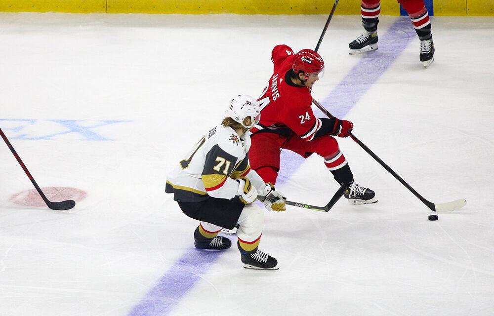 Center Seth Jarvis dribbles the puck up the ice in PNC Arena on Tuesday, Jan. 25, 2022. Jarvis had one shot in 21 shifts. The Hurricanes beat the Vegas Golden Knights 4-3.
