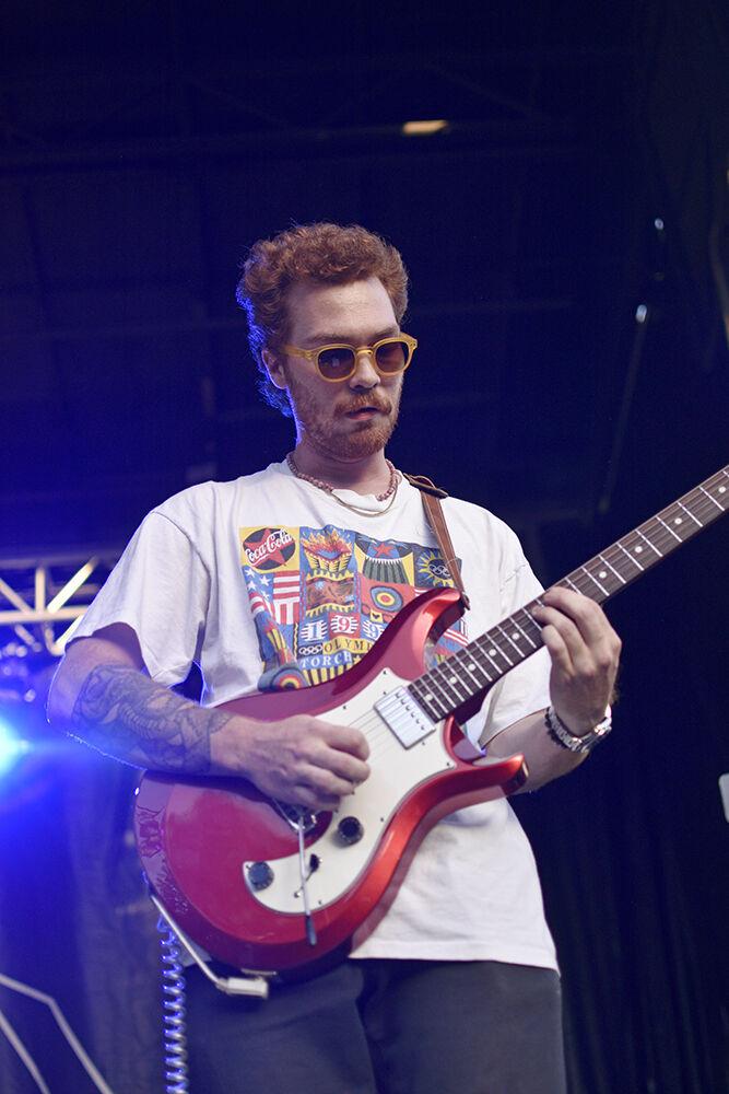 Evan Addison of the band By George plays the guitar during their set for Wolfstock on Monday, April 22, 2022 at Stafford Commons. By George opened the concert and the bands The Backseat Lovers and COIN followed during the last day of class concert. Wolfstock is a day long festival and concert hosted by NC State&#8217;s University Activities Board.
