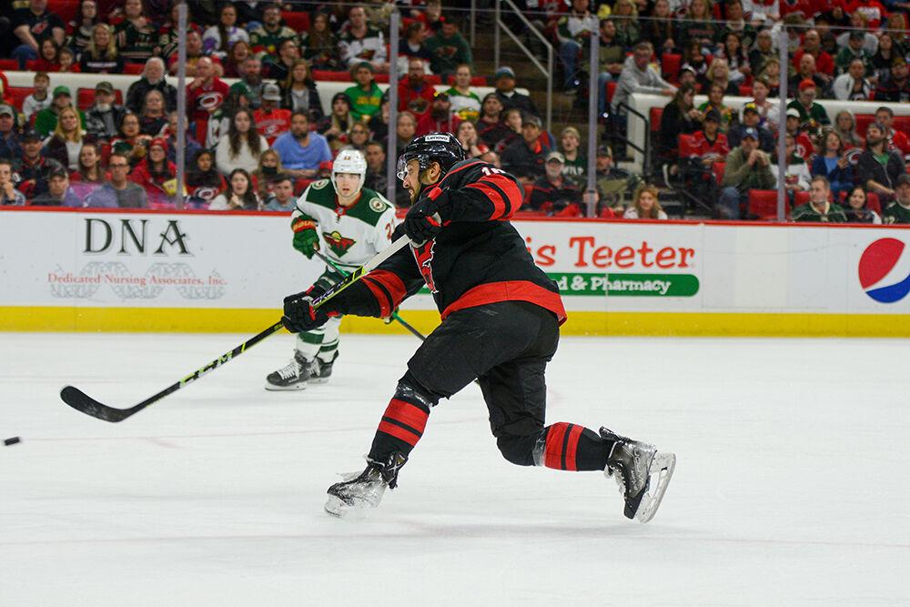 Carolina Hurricanes center Vincent Trocheck shoots the puck to the goal during the game against the Minnesota Wild on Saturday, April 2, 2022 in PNC Arena. Trocheck won 14 of the 18 total faceoffs he was part of. The Hurricanes lost 3-1.