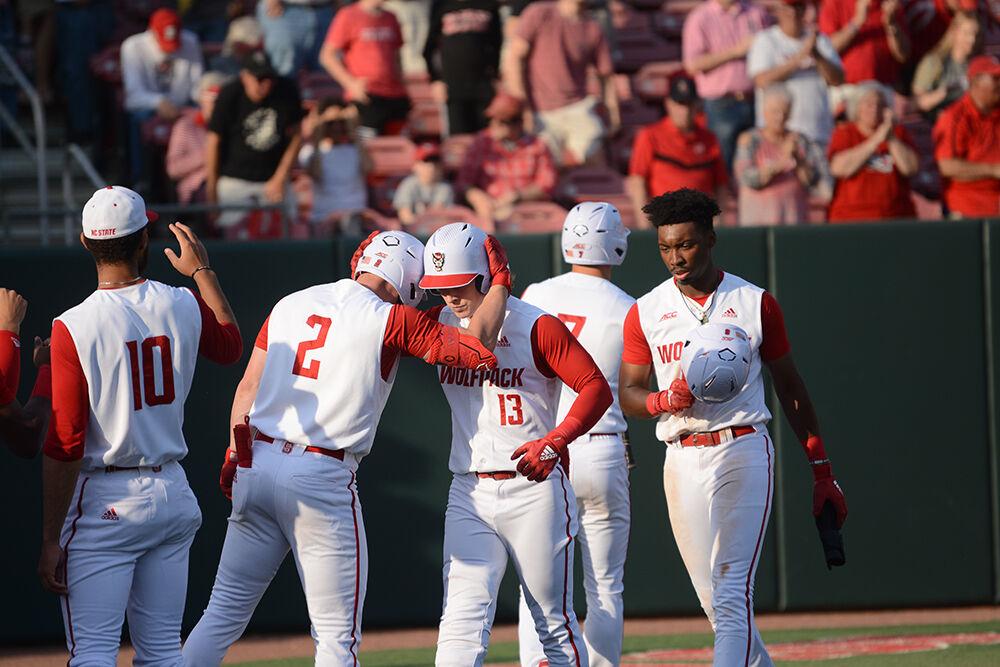 Sophomore outfileder Dominic Pilolli hugs sophomore outfielder Noah Soles after hitting a home run during the baseball game against UNC-Wilmington at Doak Field on Tuesday, April 12, 2022. The Wolfpack beat the Seahawks 7-6.