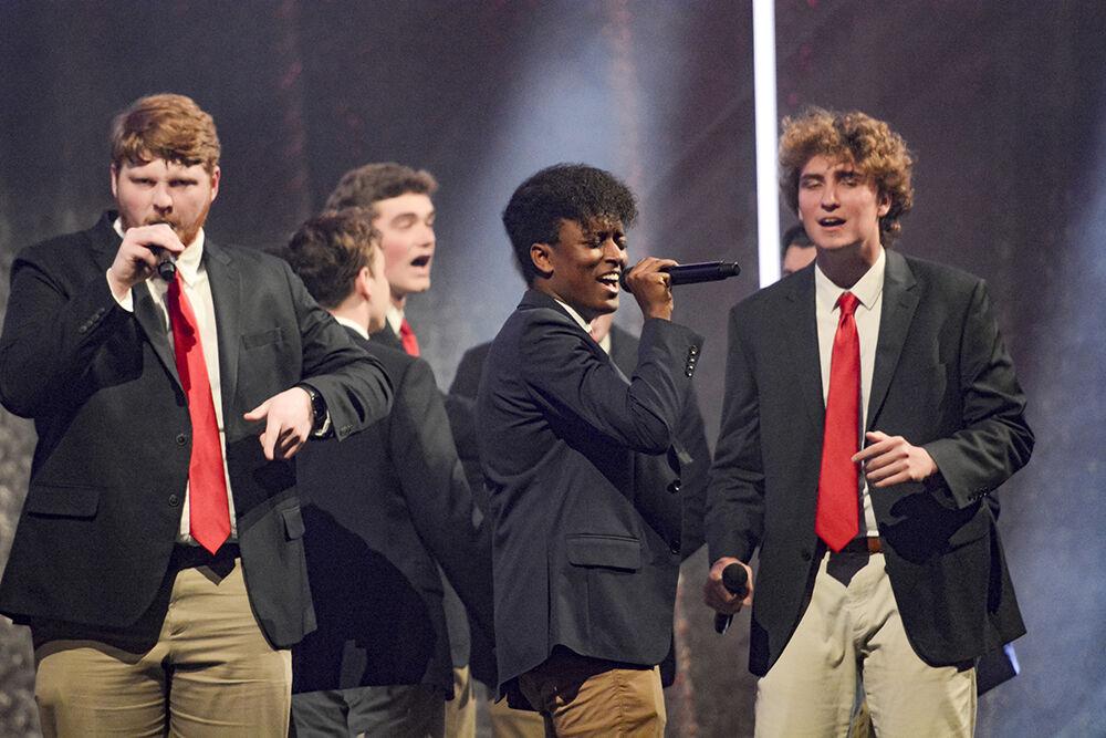 Nahom Habtemariam, a first-year in computer science, sings with the Grains of Time, North Carolina&#8217;s oldest all-male collegiate a cappella group, during the Ring Ceremony in Reynolds Coliseum on Wednesday, April 27, 2022. The Alumni Association held the ceremony for all the students and alumni who have completed 60 or more undergraduate credits or studied in a master's or doctoral program.