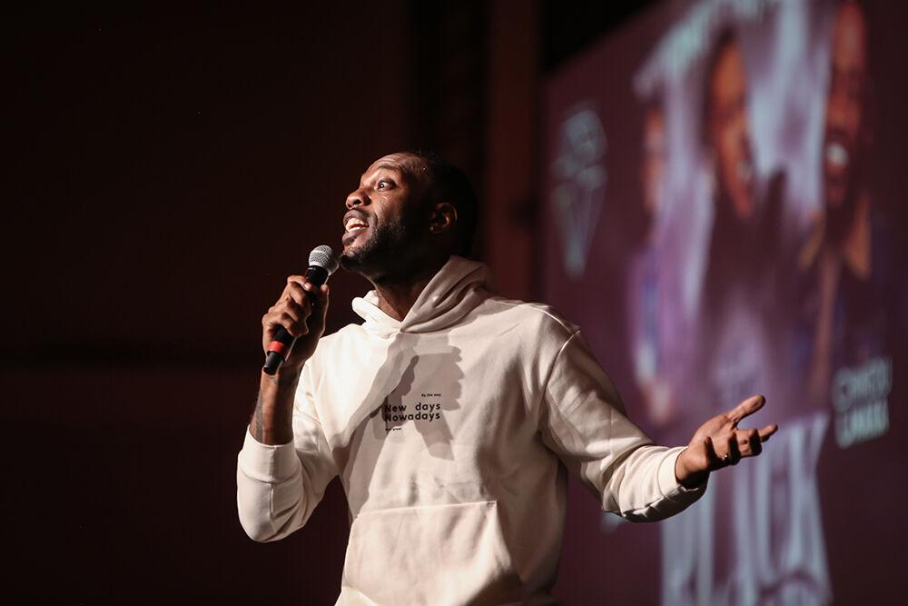 Stand up comic B Daht performs during Pan-Afrikan Week's Black Out Loud Comedy Show in Talley Student Center on Wednesday, Apr. 6, 2022.
