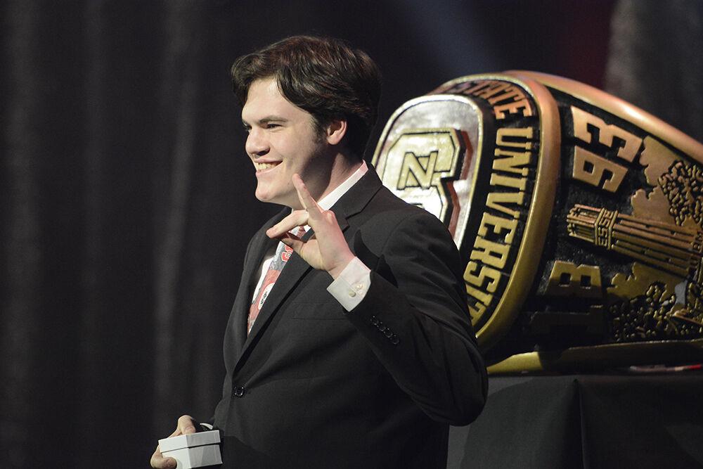 Josh Reddick, a third-year in agricultural education, poses for his photo in front of the ring during the Ring Ceremony in Reynolds Coliseum on Wednesday, April 27, 2022. The Alumni Association held the ceremony for all the students and alumni who have completed 60 or more undergraduate credits or studied in a master's or doctoral program.