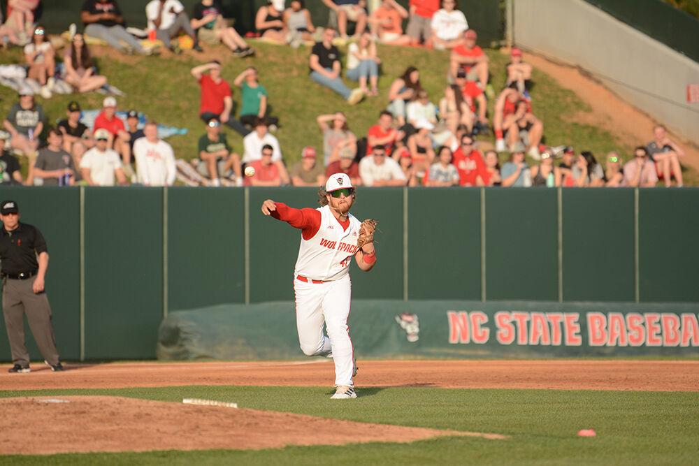 Freshman infielder Tommy White throws the ball to home base during the baseball game against UNC-Wilmington at Doak Field on Tuesday, April 12, 2022. The Wolfpack beat the Seahawks 7-6.