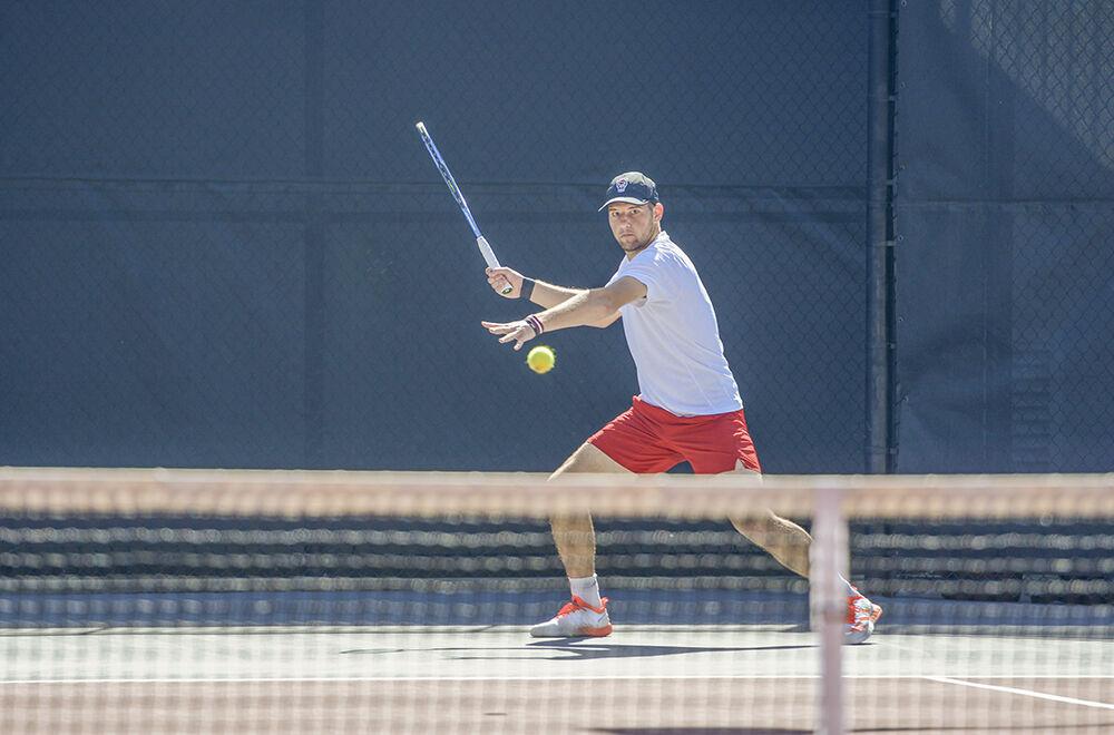 Sophomore Lucas Stateheli prepares to hit the ball back to his opponent during his doubles match against Northwestern on Monday, March 21, 2022 at the J.W. Isenhour Tennis Center. NC State beat Northeastern 4-2.