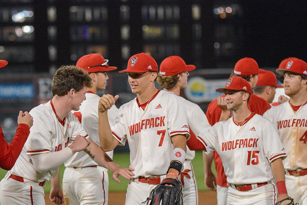 The team bumps first post game after NC State's home game against East Carolina on Tuesday, April 26, 2022 in Doak Field at Dail Park. The Wolfpack had two home runs and a grand slam during the 12-3 win over the Pirates.