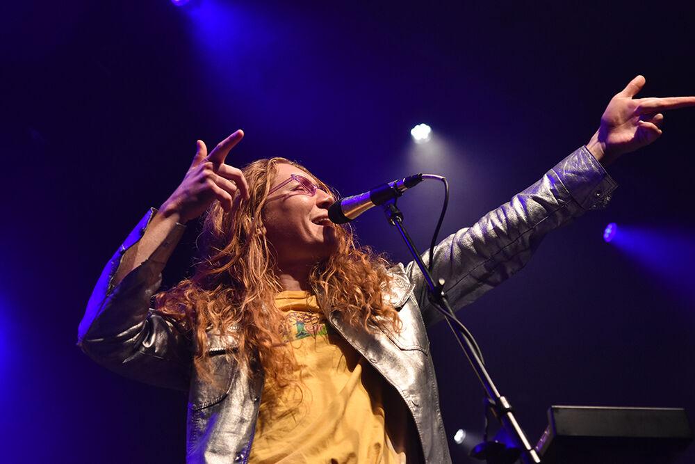 Singer Zach Grace sings "heart" and points to the crowd during flor's set at The Band CAMINO concert at the Ritz in Raleigh on Friday, April 22, 2022.