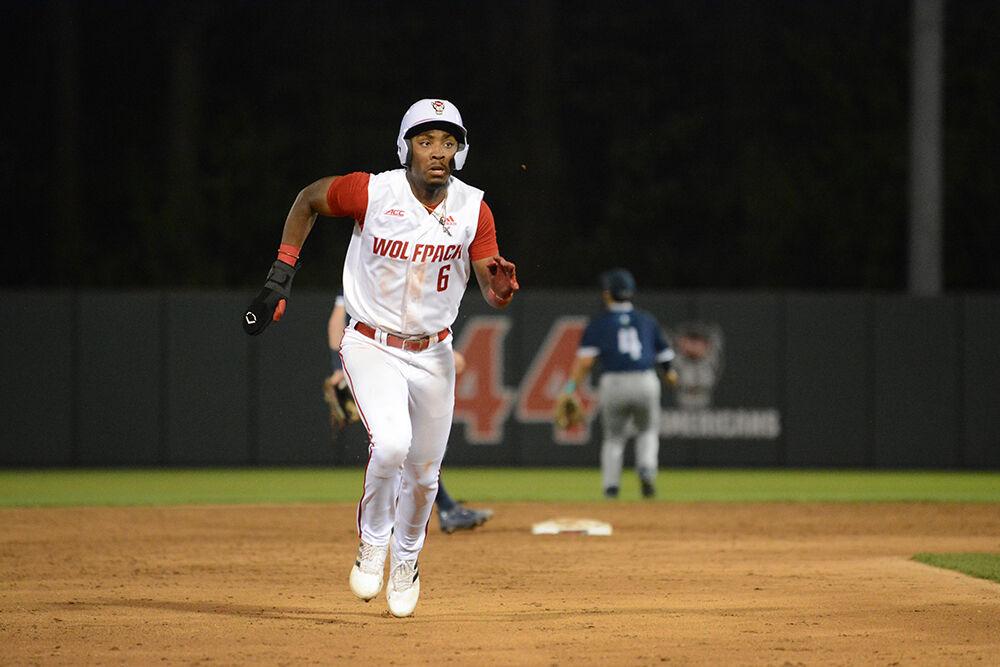Sophomore infielder LuJames Groover III runs to third base during the baseball game against UNC-Wilmington at Doak Field on Tuesday, April 12, 2022. The Wolfpack beat the Seahawks 7-6.