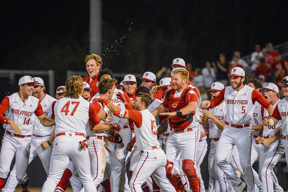The NC State baseball team celebrates its walk-off win against UNC-Wilmington on Tuesday, April 12, 2022 at Doak Field. The Pack beat the Seahawks 7-6.