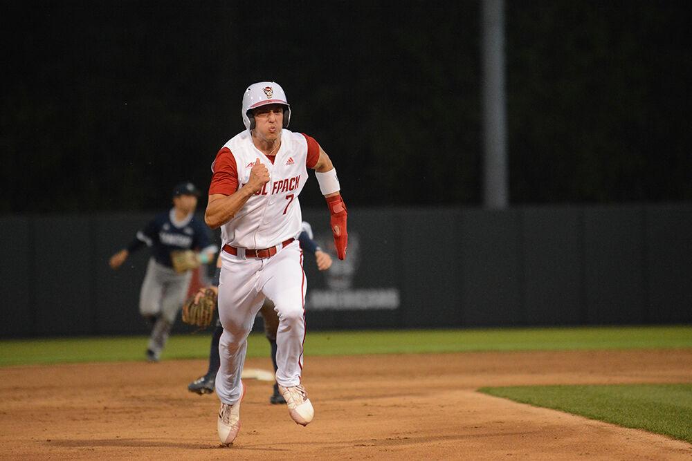 Freshman infielder Josh Hood sprints to third base during the baseball game against UNC-Wilmington at Doak Field on Tuesday, April 12, 2022. The Wolfpack beat the Seahawks 7-6.