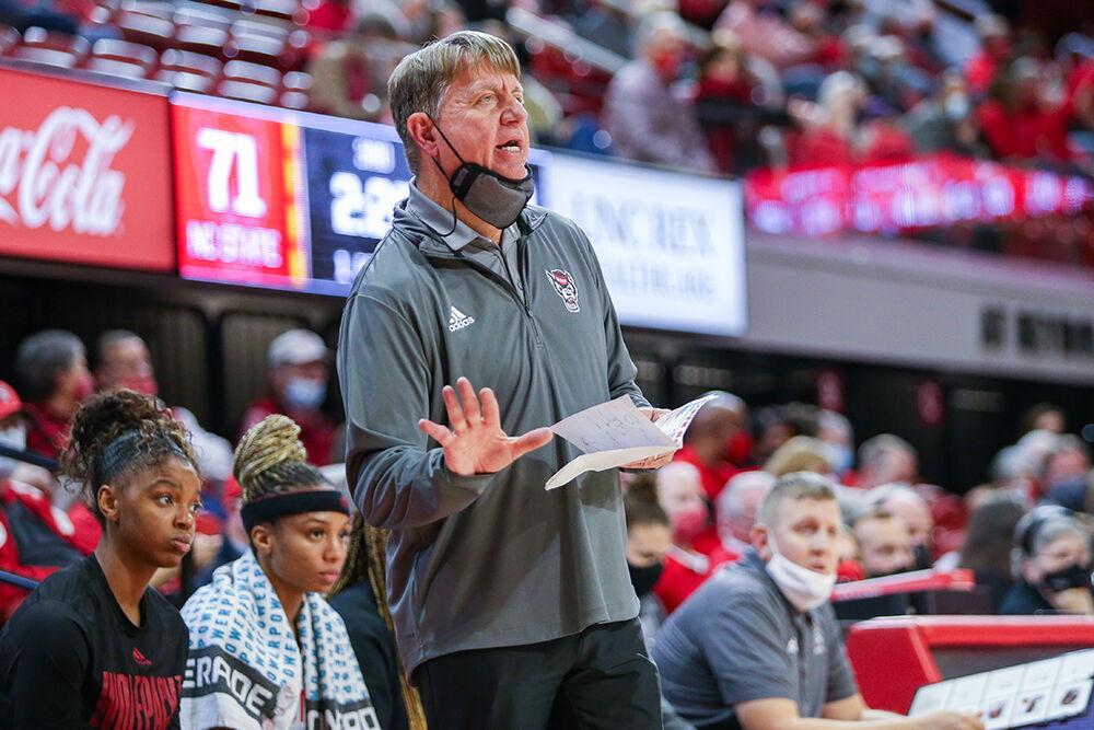 Head coach Wes Moore signals to the team during the game against Towson. NC State took down Towson 100-52 in Reynolds Coliseum on Monday, Nov. 15, 2021.