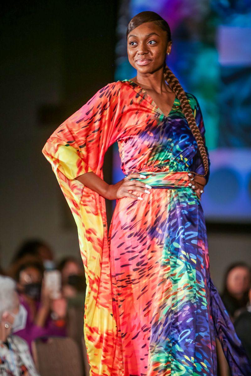 A model shows off the collection of designers Destiny Hill and Sydni Mottley during the 24th Annual Fashion Expos&#381;, hosted by the African American Textile Society as part of Pan-Afrikan Week, in Talley Student Union on Thursday, April 7, 2022. Hill and Mottley won the Intermediate category with a collection that featured draped fabrics and bright colors.