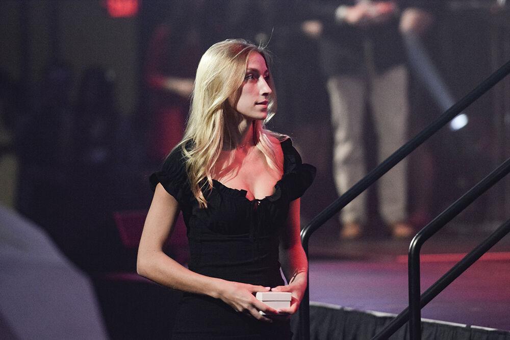 Sydney Edwards, a third-year in animal science, waits to get her photo taken in front of the ring during the Ring Ceremony in Reynolds Coliseum on Wednesday, April 27, 2022. The Alumni Association held the ceremony for all the students and alumni who have completed 60 or more undergraduate credits or studied in a master's or doctoral program.