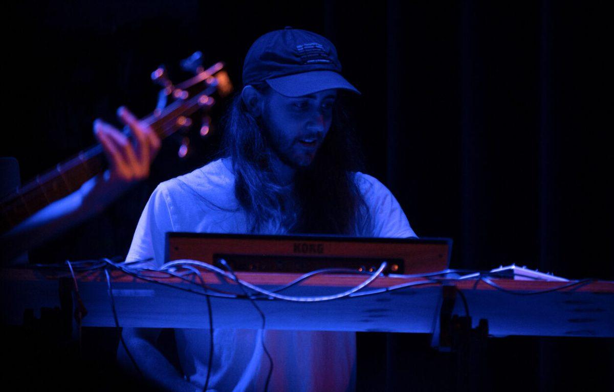 Jeremy Shoop checks his equipment during Raygun Superstar's performance at Motorco Music Hall in Durham, NC, on Friday,&#160;April 29, 2022.