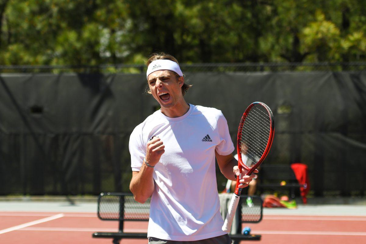 Junior Robin Catry celebrates a point in his singles game against Clemson player Spencer Whitaker on Sunday, April 10, 2022 at the J.W. Isenhour Tennis Center. Catry and sophomore Luca Staeheli won their doubles match. NC State won overall against Clemson 5-2.