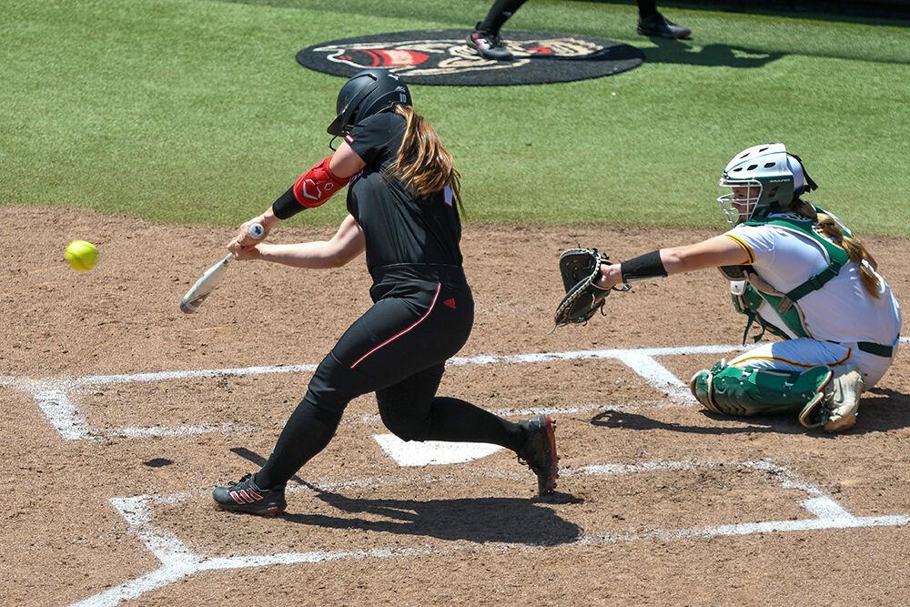 Fifth-year infielder Logan Morris swings and hits the ball during the game against Norfolk State on Wednesday, April 27, 2022 in Dail Softball Stadium. Morris had one hit and one run in the game. NC State beat Norfolk State 4-1.