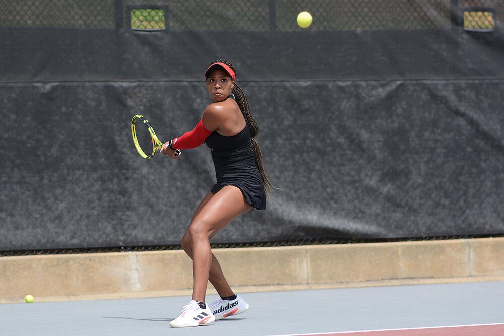 Graduate student Jaeda Daniel prepares to backhand the ball during the match against Notre Dame on Saturday, April 16, 2022 at Dail Outdoor Tennis Stadium. The Wolfpack won 7-0.