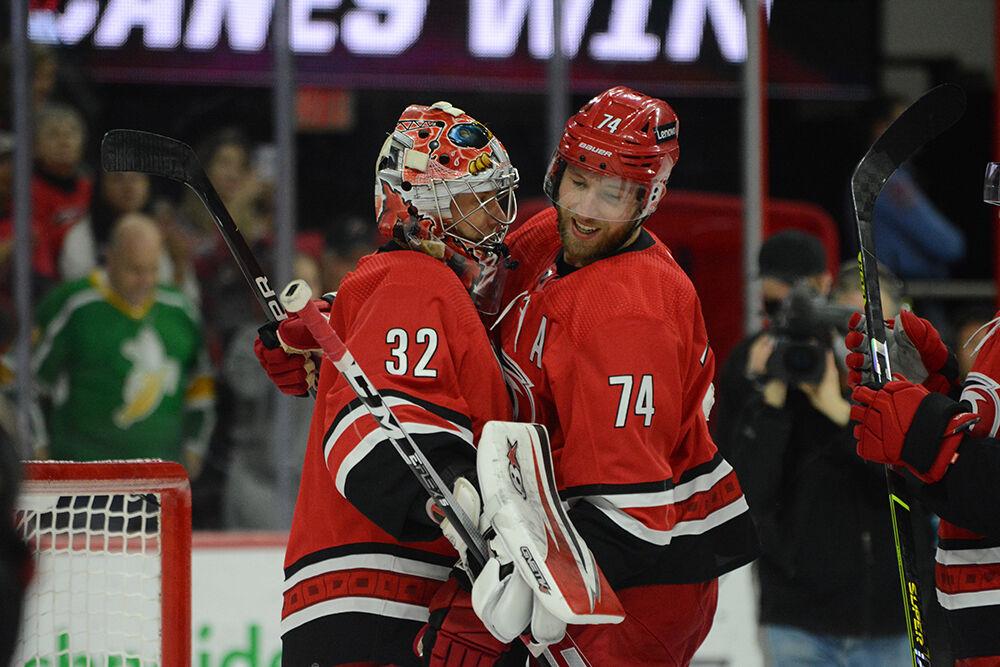 Defenseman Jaccob Slavin hugs goaltender Antti Raanta after the home game against the Winnipeg Jets in PNC Arena on Thursday, April 21, 2022. The Canes beat the Jets 4-2. Slavin scored one goal and Raanta had 20 saves from 22 shots.