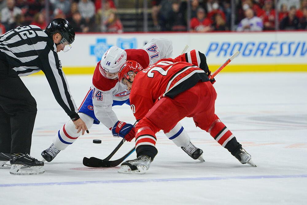 Carolina Hurricanes center Sebastian Aho fights to win a faceoff during the game against Montreal on Thursday, March 31, 2022 in PNC Arena. The Hurricanes won 39 of 60 total faceoffs throughout the evening. The Hurricanes shutout the Canadiens 4-0.