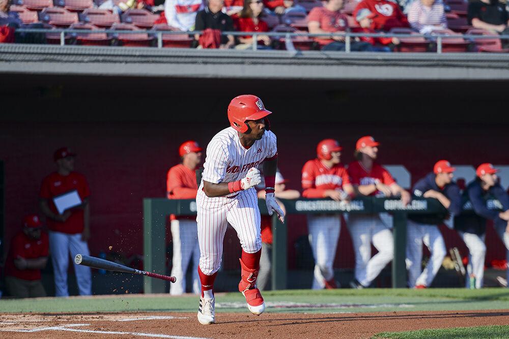 Sophomore infielder LuJames Groover III throws his bat down and sprints to first base during the game against Radford on Friday, April 29, 2022. NC State beat Radford 6-2.