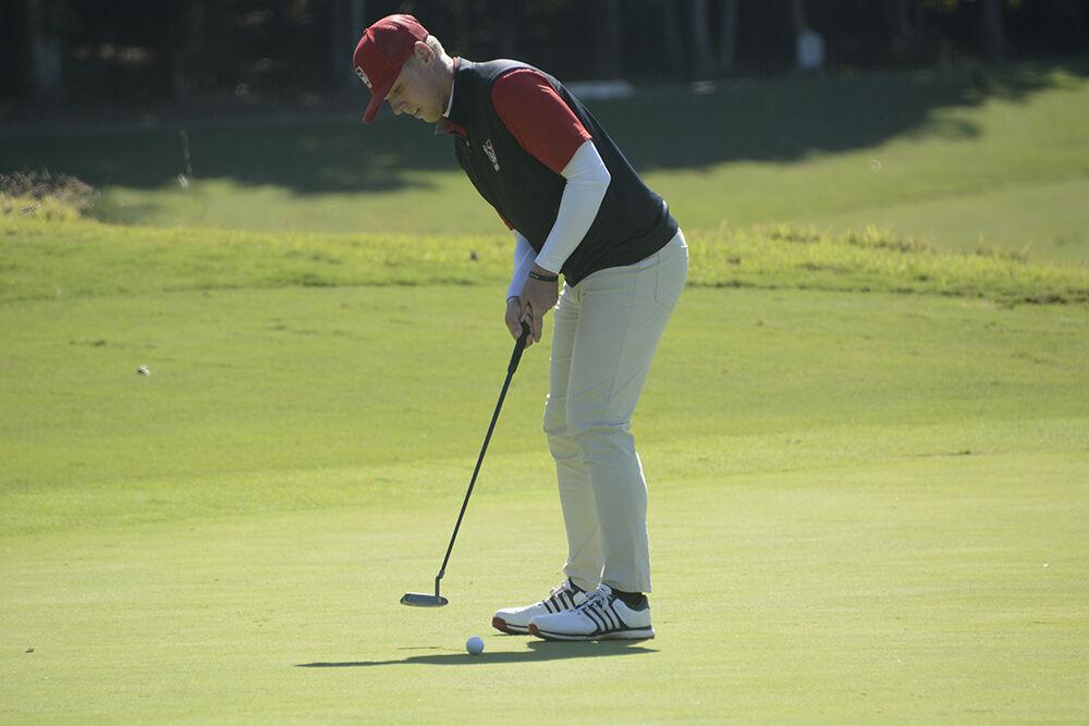 Graduate student Easton Paxton putts the ball during the Wolfpack Intercollegiate on Sunday, Oct. 17, 2021 at Lonnie Poole Golf Course. Paxton finished third with a score of seven-under par.&#160;The Pack won the tournament with an overall score of 17-under.