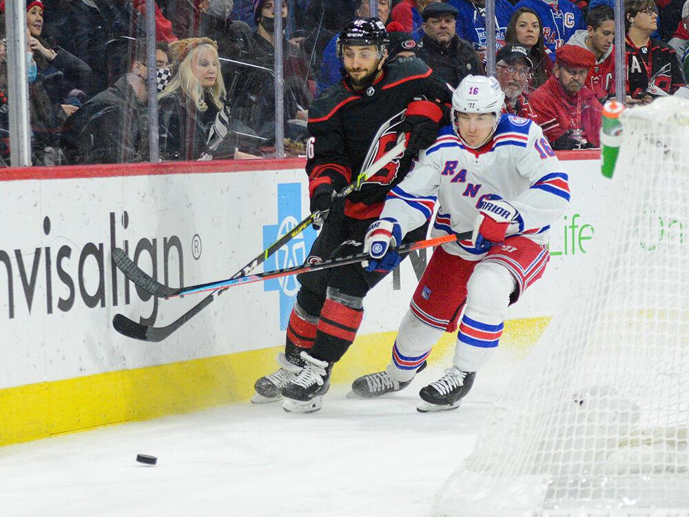 Center Vincent Trocheck races for the puck in PNC Arena on Friday, Jan. 21, 2022. The Hurricanes beat the New York Rangers 6-3.
