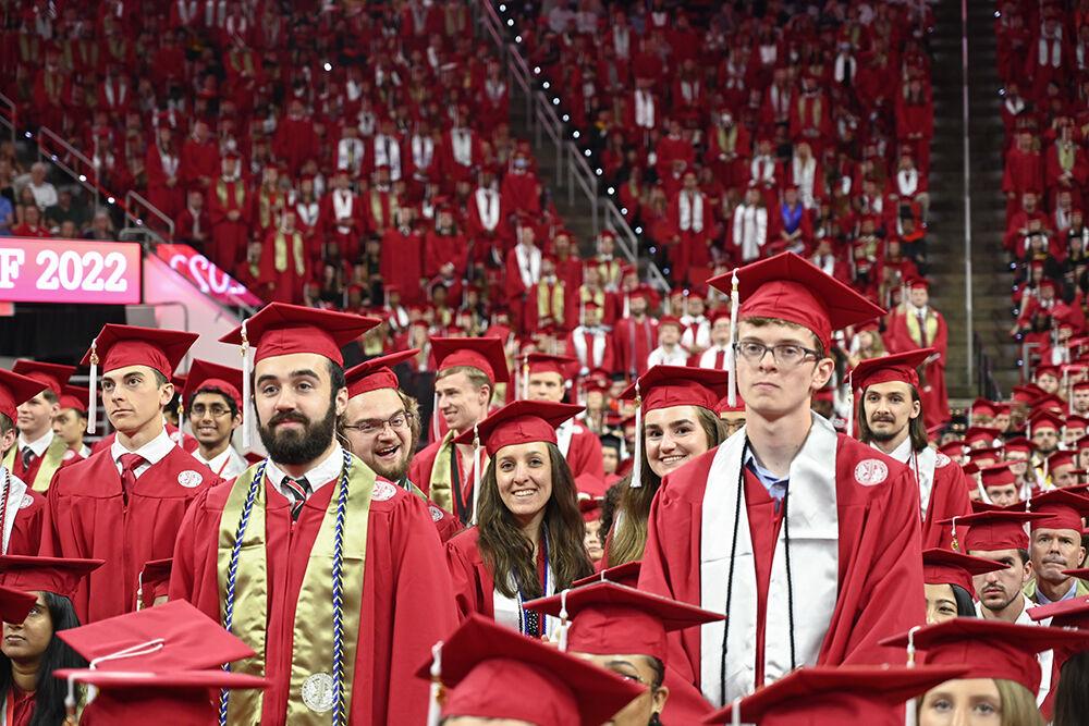 NC State graduates stand as their department in named at the NC State Commencement in PNC Arena on Saturday, May 7, 2022.