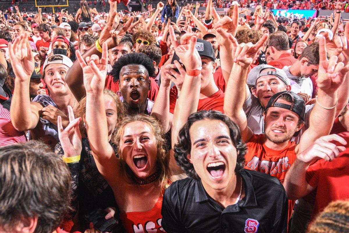 NC State fans rush the field after the Wolfpack beat Clemson in the game on Saturday, Sept. 25, 2021 in Carter-Finley Stadium. This ended the longest streak for every time. The Wolfpack beat the Tigers 27-21 in double overtime.