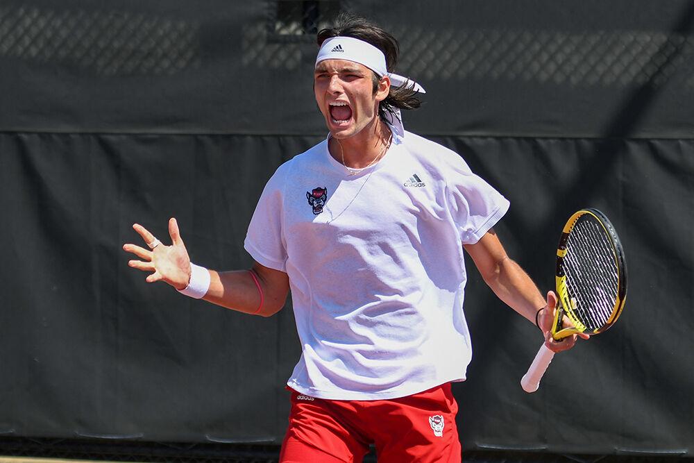 Freshman Damien Salvestre cheers after winning a game in his singles match against UNC-Chapel Hill player on Sunday, April 17, 2022 at the J.W. Isenhour Tennis Center. Salvestre won his singles match 2-0. The Wolfpack lost the overall match 4-3.