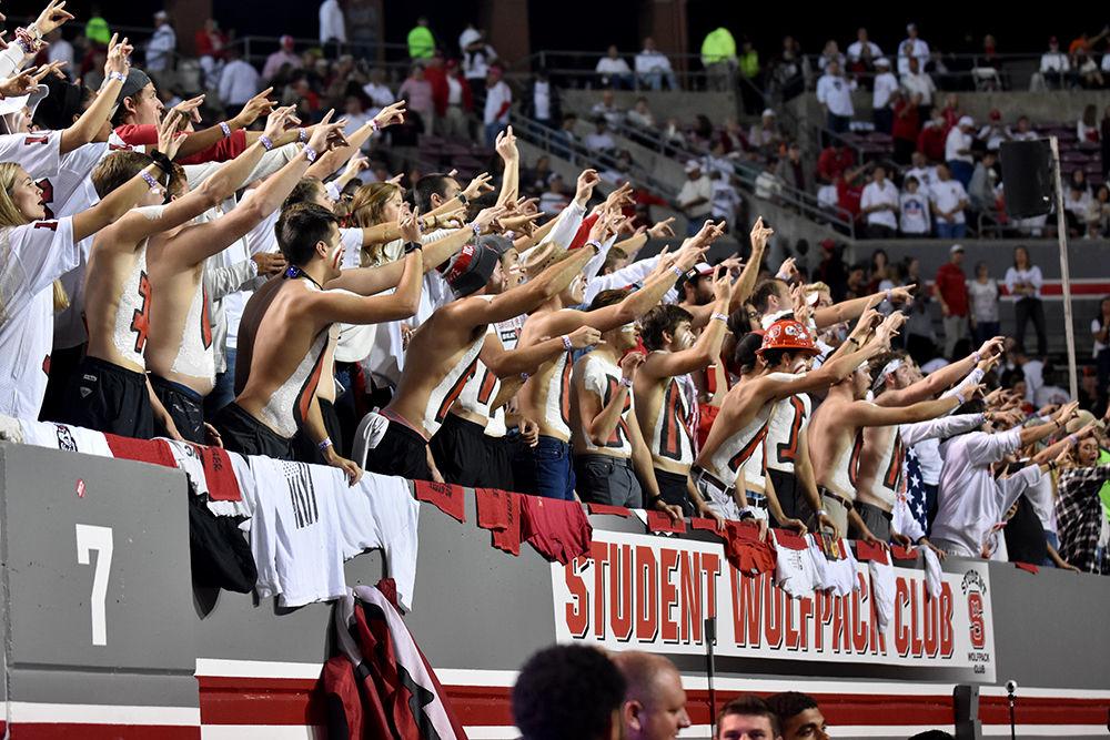 NC State students cheer in the student section during the game against Syracuse on Thursday, Oct. 10, 2019 in Carter-Finley Stadium. The Pack beat the Orange 16-10.