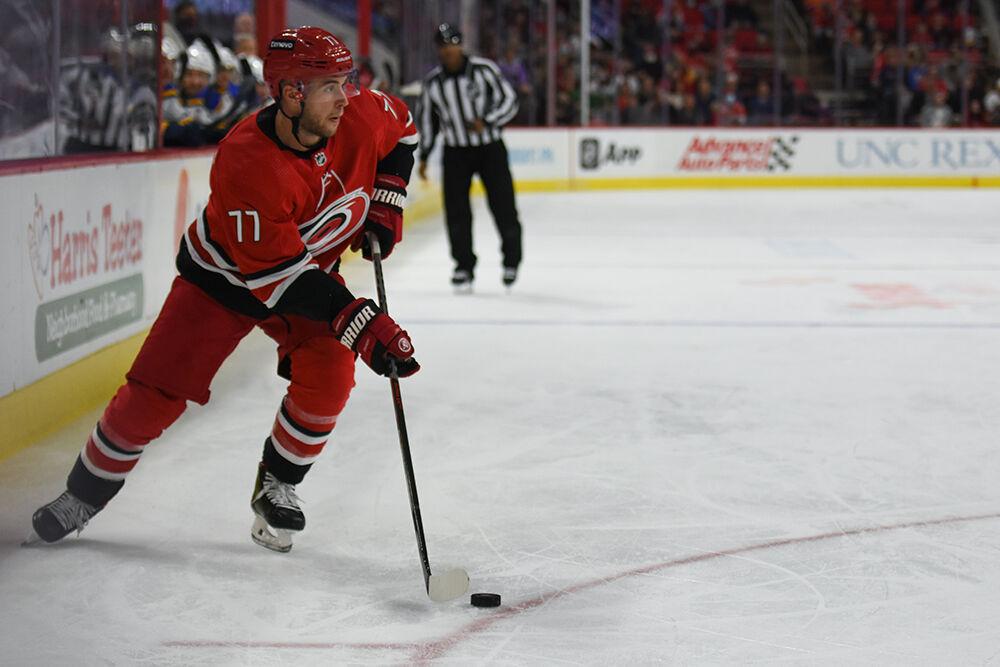 Defender Tony DeAngelo holds possession of the puck in the game against the St. Louis Blues in PNC Arena on Saturday, Nov. 13, 2021. The Hurricanes beat the Blues 3-2.
