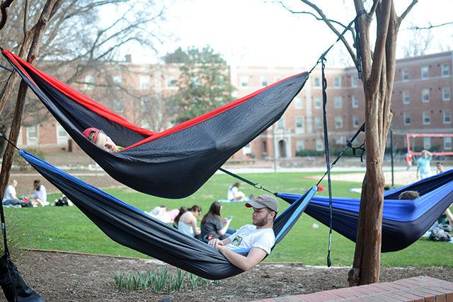 Rory Lazenby, a sophomore studying economics, and Trevor Graham, a sophomore studying sustainable materials &amp; technology,lay in their hammocks on Tucker Beach March 1, 2016. The two first met while Graham was playing rugby. Lazenby said, "I saw him throwing the rugby ball once and was like, 'what's up, bro!'" Graham and Lazby are on the club rugby team together.