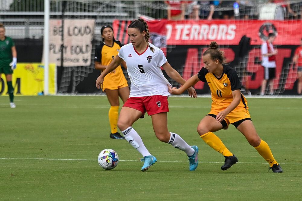 Graduate student defender Jenna Butler dribbles the ball during the match against Virginia Commonwealth on Sunday, Aug. 21, 2022 at Dail Soccer Field. NC State won 2-1.