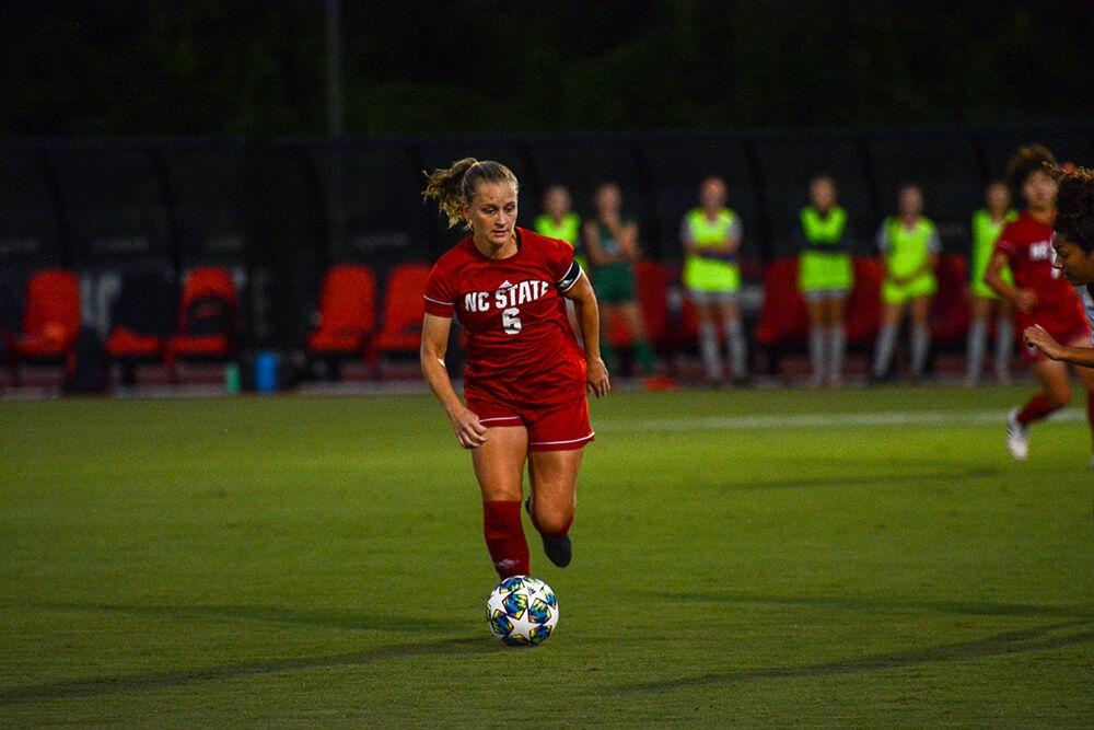 Redshirt junior defender Lulu Guttenberger dribbles the ball in the Wolfpack's game against the Tigers on Thursday, Sept. 23, 2021 at Dail Soccer Field. Guttenberger had one assist during NC State's 2-1 loss to Clemson.
