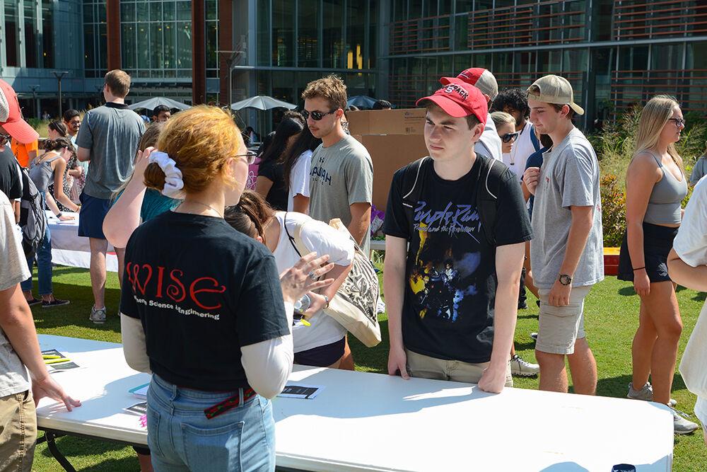 Tyler Hill, a junior in bioprocessing science, receives information about WISE, Women In Science and Engineering at the Student Involvement Fair at Stafford Commons on Friday, Aug. 26, 2022. The Student Involvement Fair was an event that gave students the opportunity to learn about a wide range of clubs and organizations.