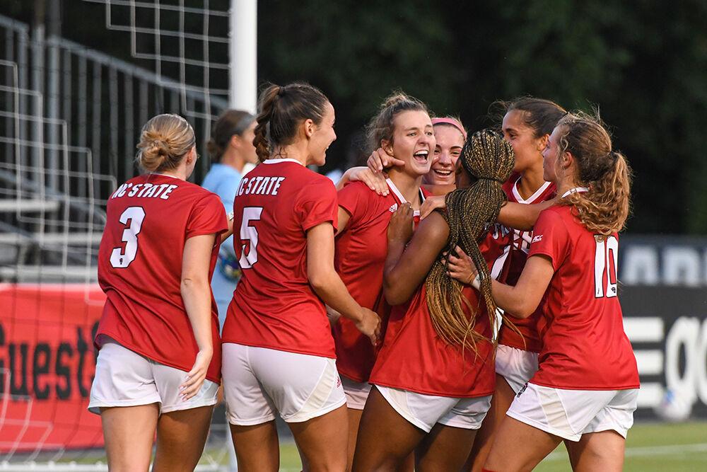 Freshman defender Taylor Chism (middle) celebrates with teammates after scoring in the game against Rhode Island on Thursday, Aug. 18, 2022 at Dail Soccer Field. Chism made two shots and one goal for the Wolfpack. NC State beat Rhode Island 4-0.