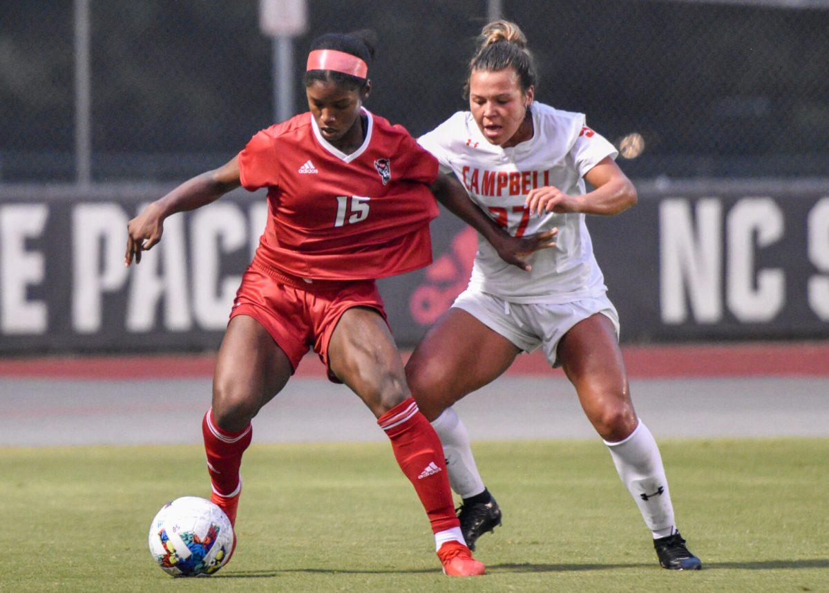 Senior forward Jameese Joseph struggles for possession of the ball during the match versus the Campbell Camels on Thursday, Aug. 25, 2022 in Dail Soccer Field. Joseph secured her second goal of the season for the Wolfpack. The Wolfpack beat the Camels 1-0.