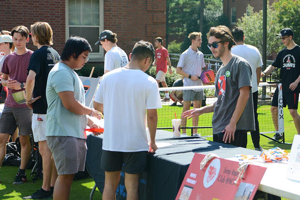 Brady Jones, a fourth-year student in aerospace engineering, gives information about the National Alliance on Mental Illness organization to fellow students at the Student Involvement Fair at Stafford Commons on Friday, Aug. 26, 2022. The National Alliance on Mental Health was an organization at NC State that hoped to improve the lives of students and destigmatize mental health.