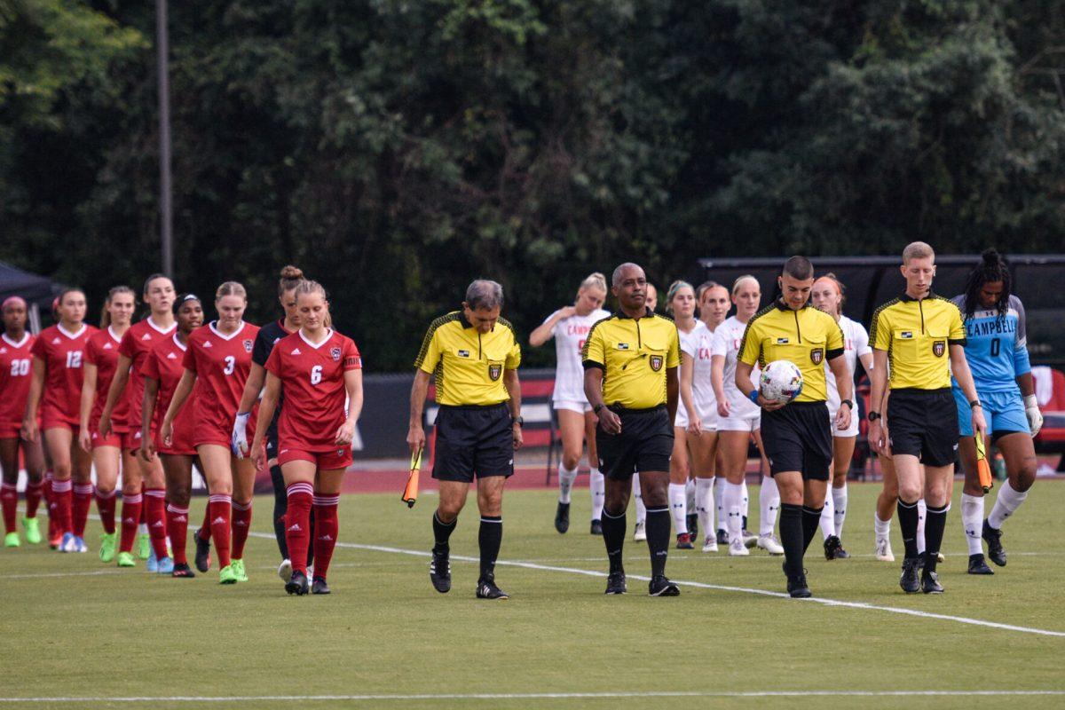 The NC State Wolfpack and Campbell Camels women's soccer teams walk onto the field at the start of the match on Thursday, Aug. 25, 2022 at Dail Soccer Field. The Wolfpack beat the Camels 1-0.