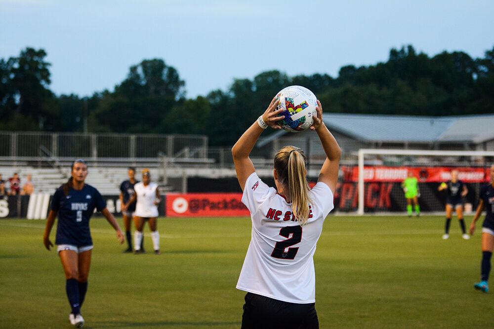 Sophmore defender Nina Zimmer prepares to pass the ball inbound during the match against the Hoyas on Sunday, Aug. 28, 2022 at Dail Soccer Field. The Wolfpack tied the match 2-2.