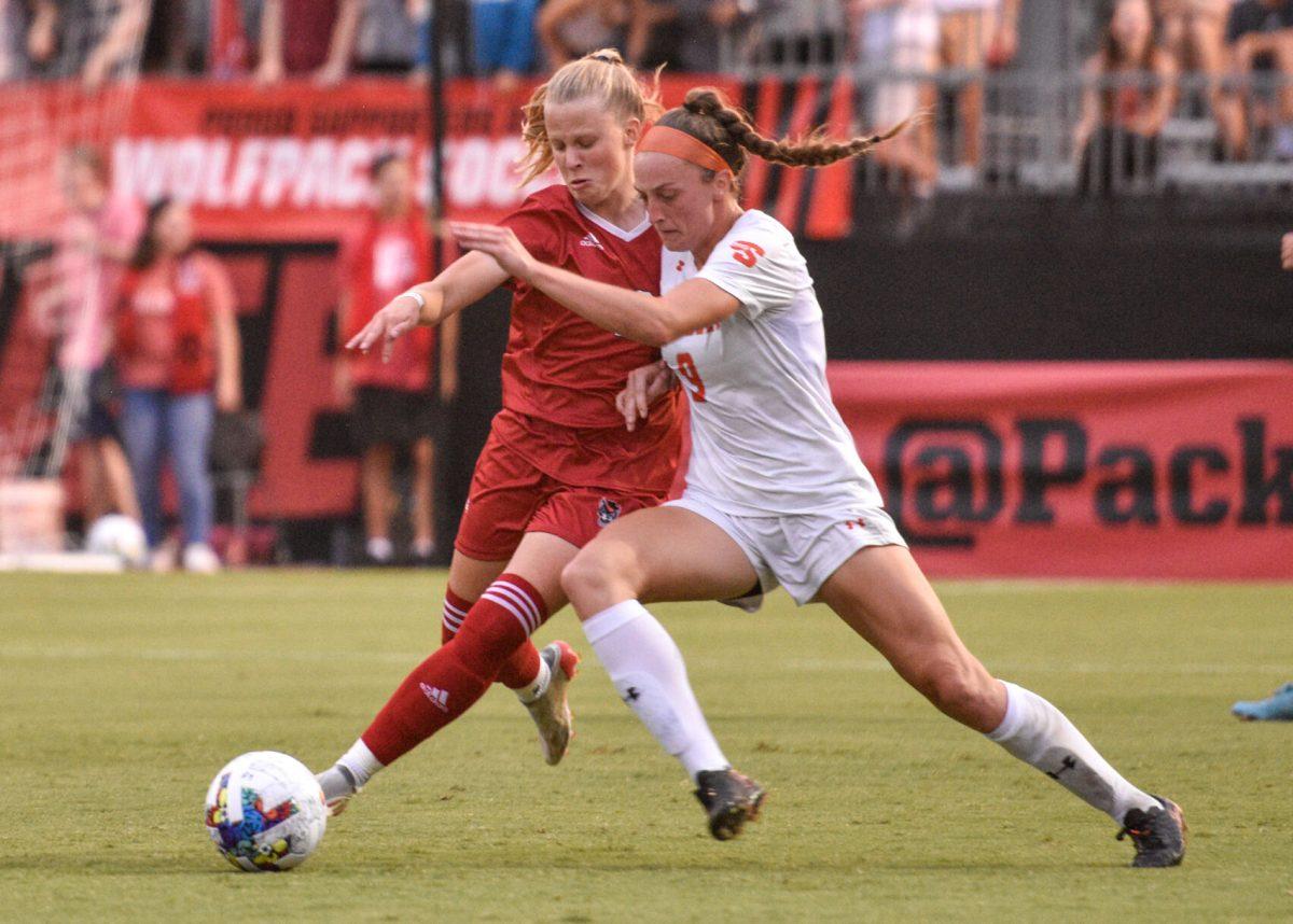 Sophomore defender Nina Zimmer battles for the possesion of the ball in the match against the Campbell Camels on Thursday, Aug 25 at the Dail Soccer Field. The Wolfpack fended off 8 shots made by Campbell. The Wolfpack beat the Camels 1-0.