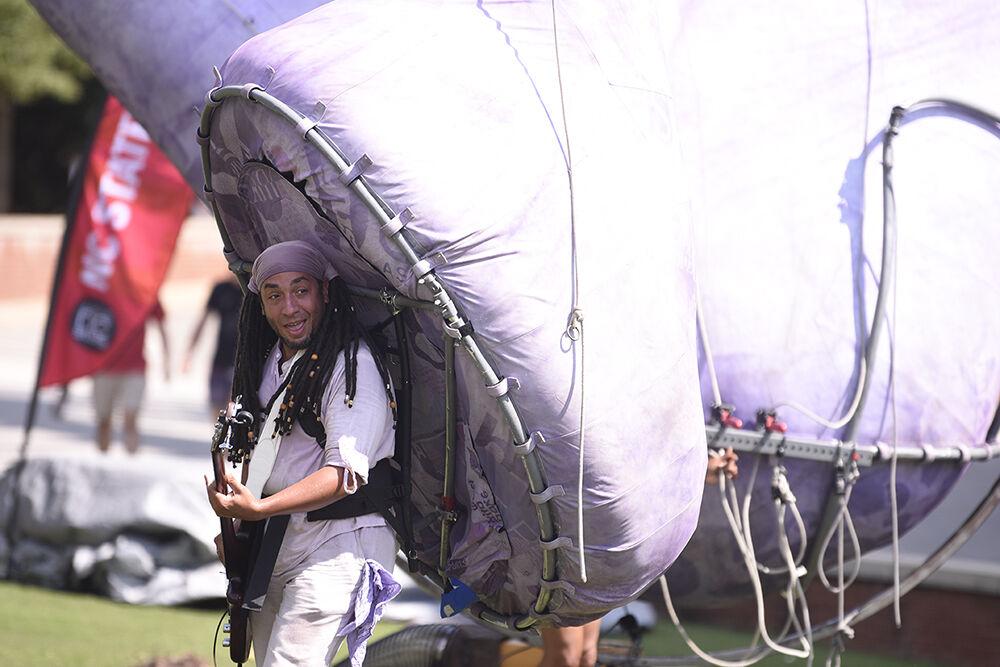A member of the group Squonk performs at the NC State LIVE block party event at Stafford Commons on Sunday, Sept. 18, 2022. NC State LIVE celebrated its 50th Anniversary with a performance from Squonk, Wolfgang A Cappella, Fusion Dance Crew, interactive crafts and food.