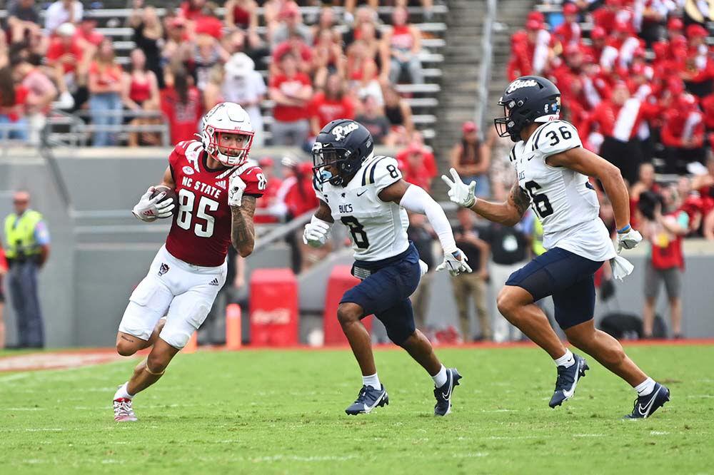 Sophomore wide receiver Anthony Smith runs the ball up the field during the Wolfpack's football game against the Charleston Southern Buccaneers at Carter-Finley Stadium on Saturday, Sept. 10, 2022. Smith had two receptions for 58 yards with one touchdown. The Wolfpack won 55-3.