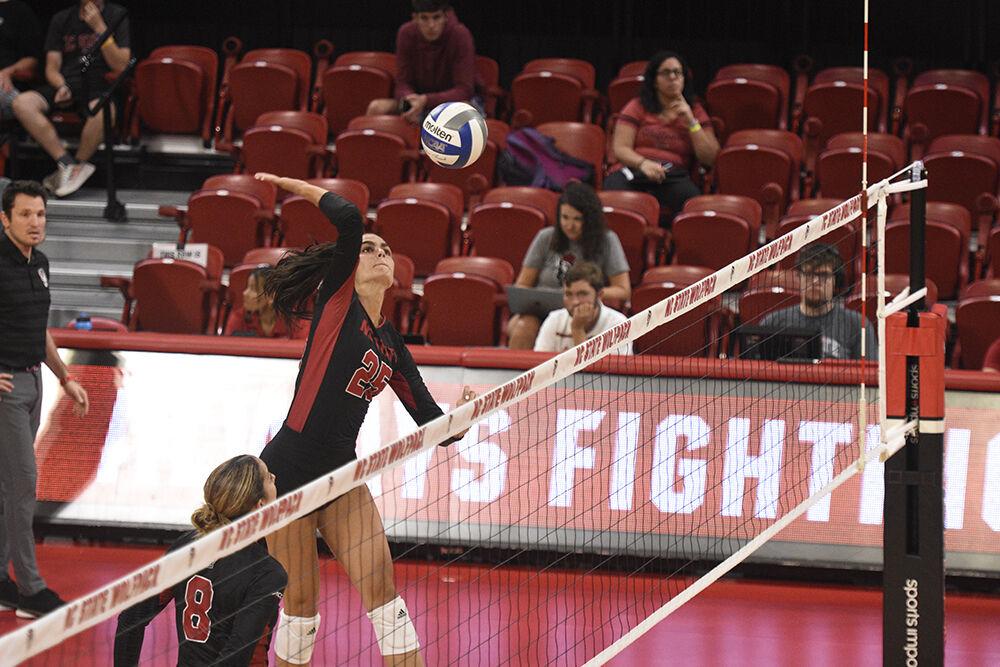 Junior middle blocker Riley Shaak spikes a ball versus WCU on Friday, Sept. 9, 2022 in Reynolds Coliseum. Shaak had three kills during NC State&#8217;s 3-0 loss to the Catamounts.