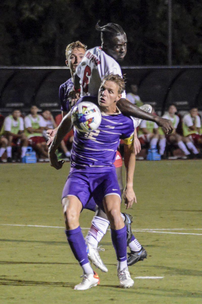 Senior defender Kendall Edwards attempts to defend the ball during the match against James Madison on Tuesday, Sept. 13, 2022 at Dail Soccer Field. NC State lost 1-0 to James Madison.